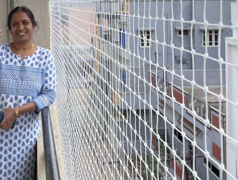 Close-up of a sturdy balcony safety net installed on a high-rise apartment in Malabar Hill.
