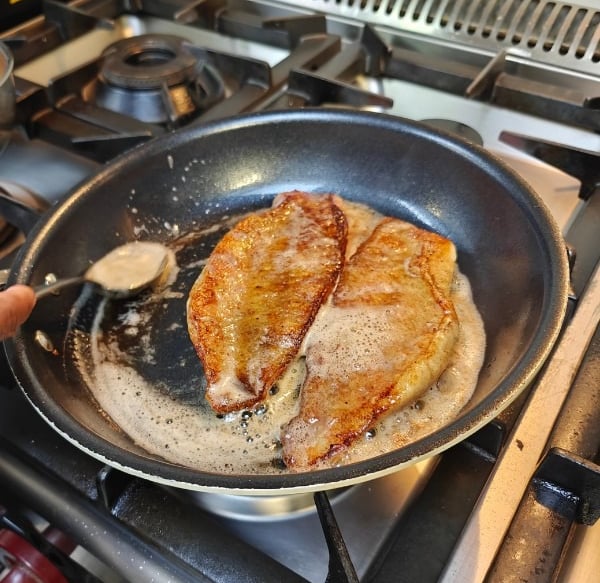 Studying the craft of cooking fish.