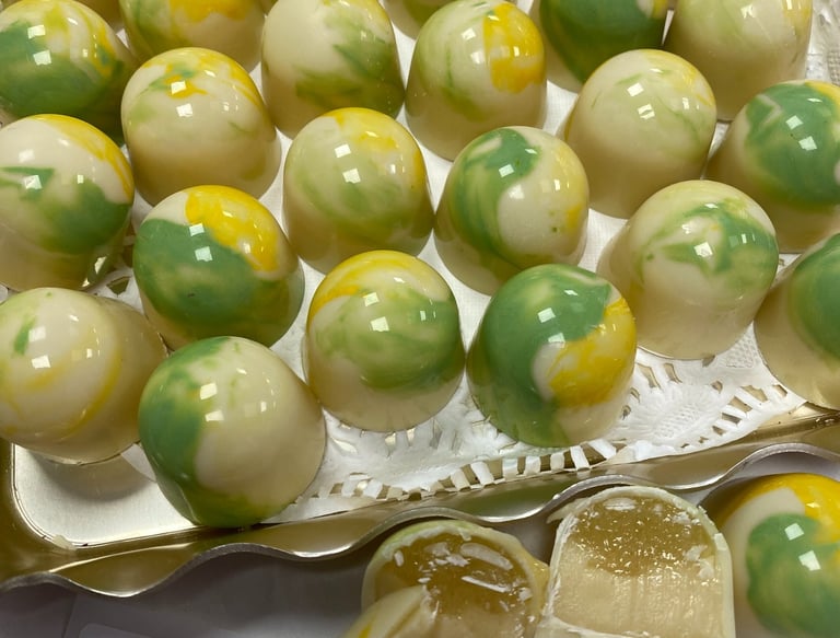 Pina colada . a layed of pina colada pate de fruit jelly with a white chocolate coconut ganache