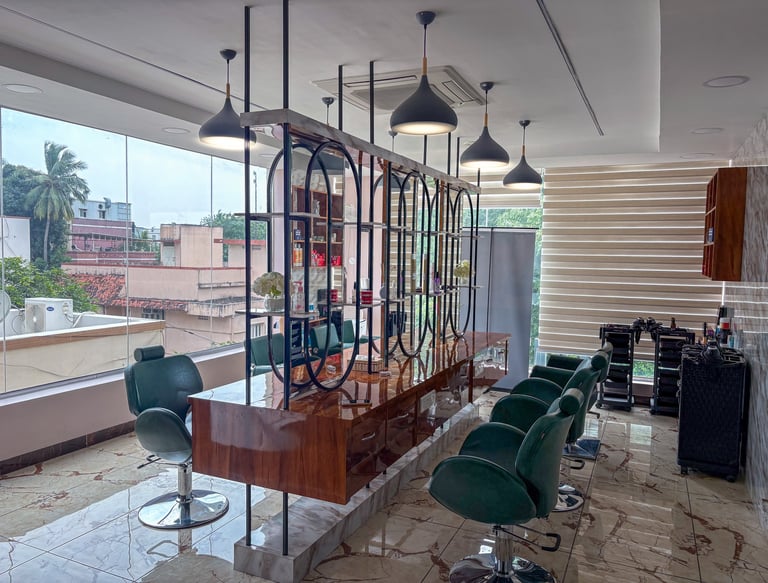 Cozy salon interior with comfortable chairs and soft lighting, showing a client receiving a facial treatment.