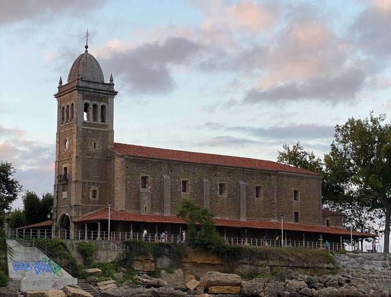a large building with a clock tower in the middle of it