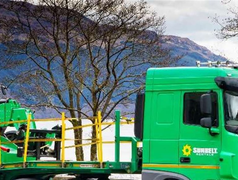 Sunbelt rentals lorry in front of Scottish loch to illustrate a testimonial