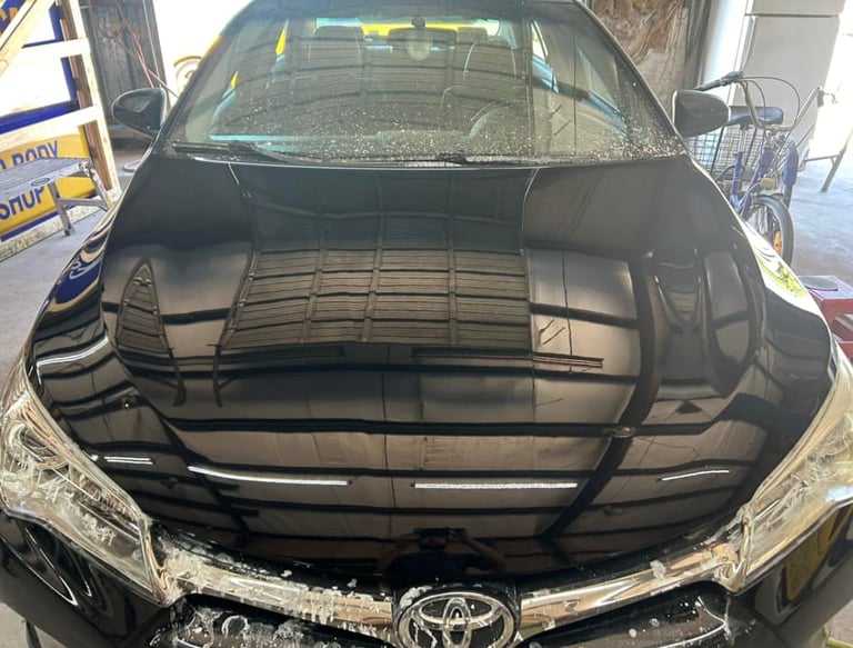 black car freshly painted