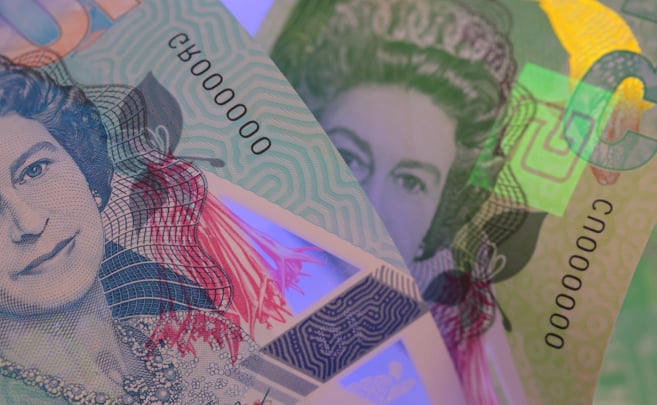 a close up of a bank note with Security Thread (Metallic Color Thread)