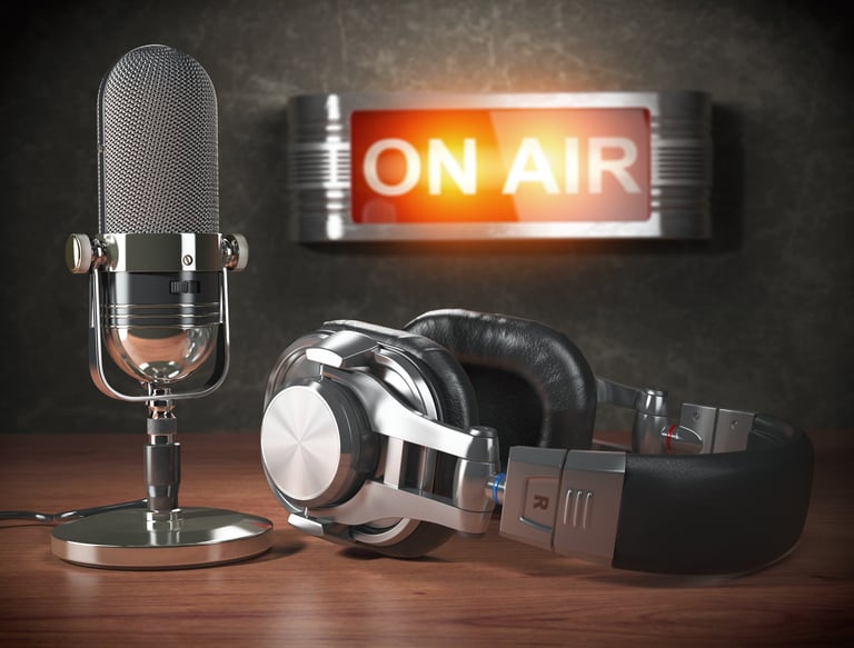 Picture of a mic headphones and a lit up 'on air' sign