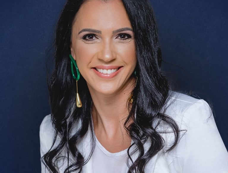 a woman with long black hair and earrings