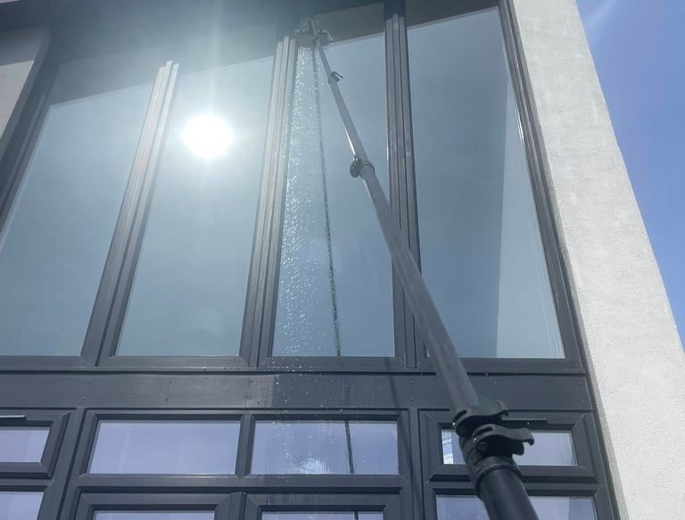 Extendable pole cleaning windows - outdoor cleaning services Fife
