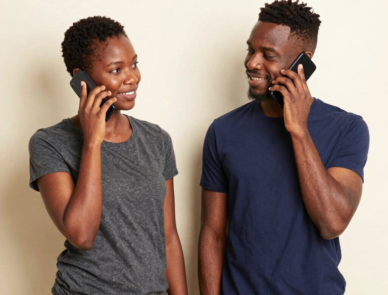 Friendly shop assistant answering a phone call in a cozy store environment.