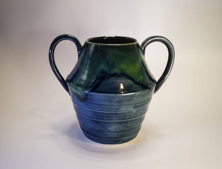 A large GonPotty vase with handles using storm and seaweed glazes