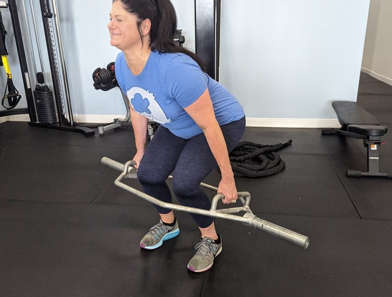 Christi lifting heavy with the hex bar