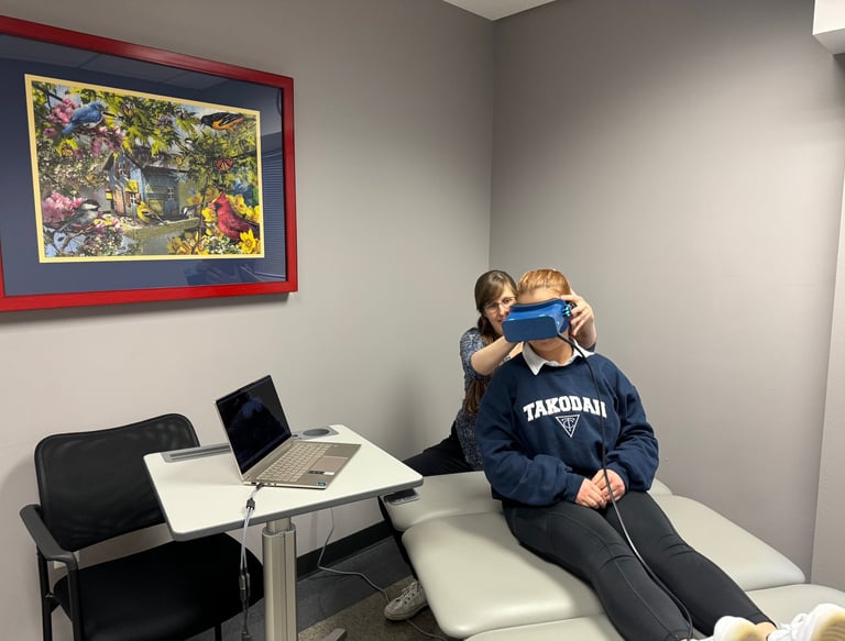 Dr. Jen Sharma helps a patient with vertigo