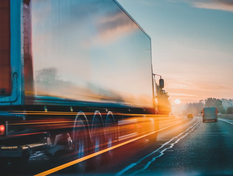 Freight truck on highway at sunrise — fast, flexible logistics and reliable delivery service.