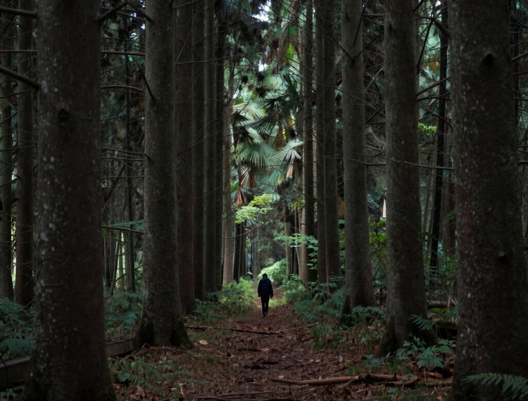Elegant workspace with minimalist design, featuring a keyboard and open books under soft natural light.
