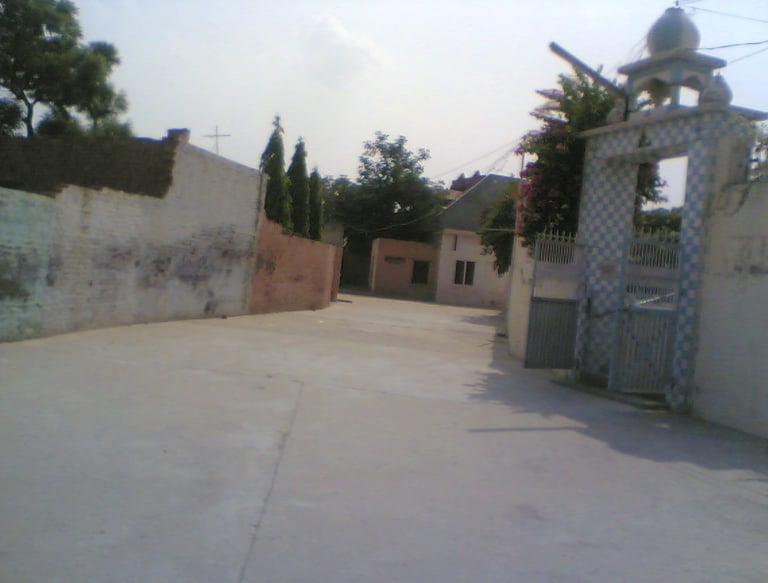 Great condition of street surrounded by houses and trees