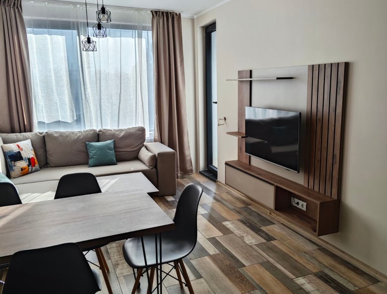 A photo of living room with tv furniture mounted on wall