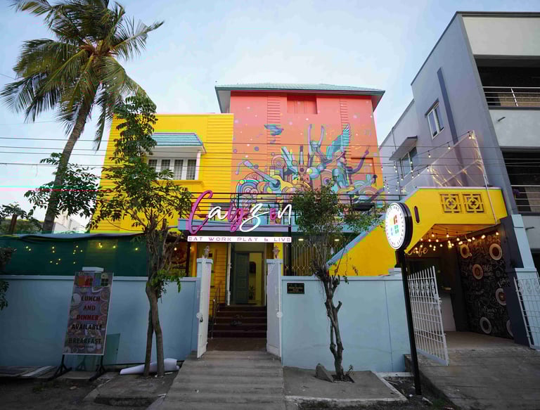 a colorful building with graffiti on the building facade.