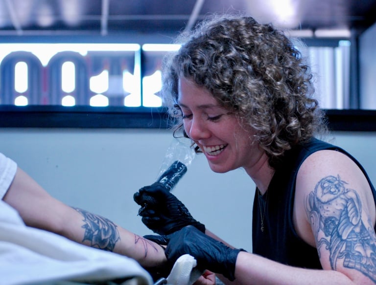 a woman tattoo artist