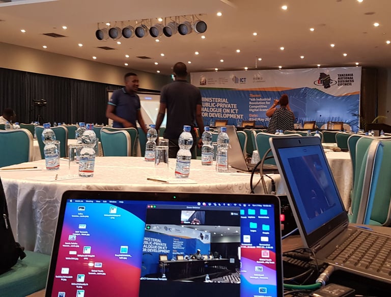 a laptop computer sitting on a table with a laptop on the table
