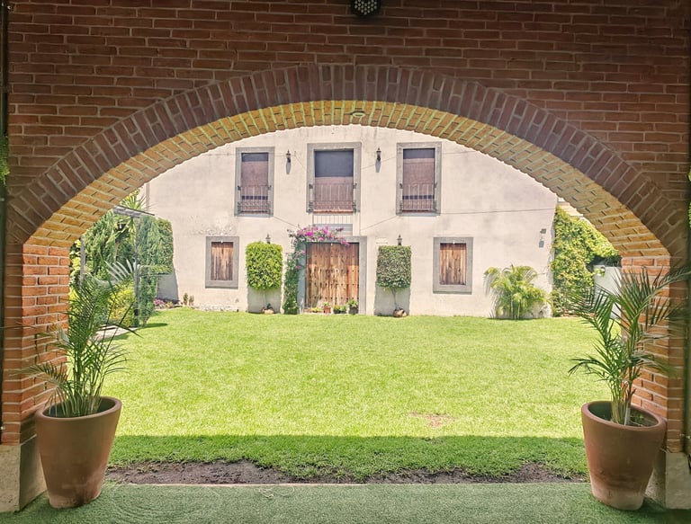 a brick wall with a clock on the outside