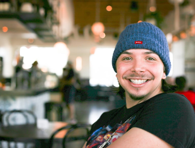 a man in a blue hat and a blue beanie