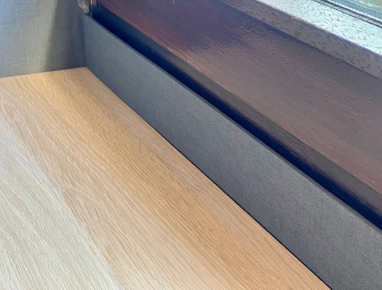 a wooden table with a wooden table top and a window