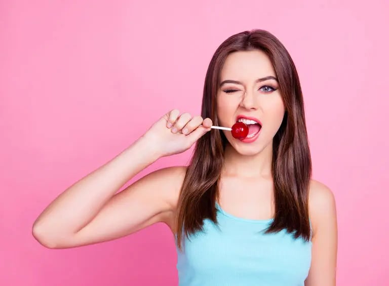 girl eating lollipop
