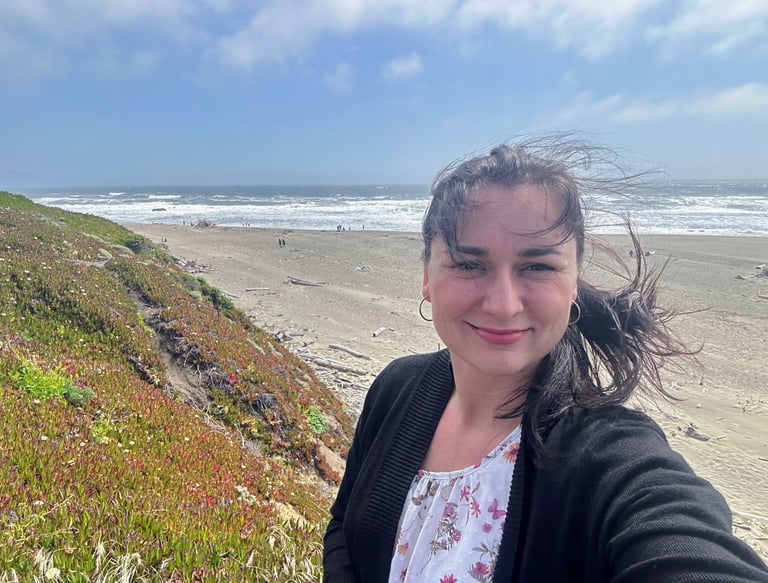 can you remove people from the background and make picture little bit dramatic (I mean beach, sky)