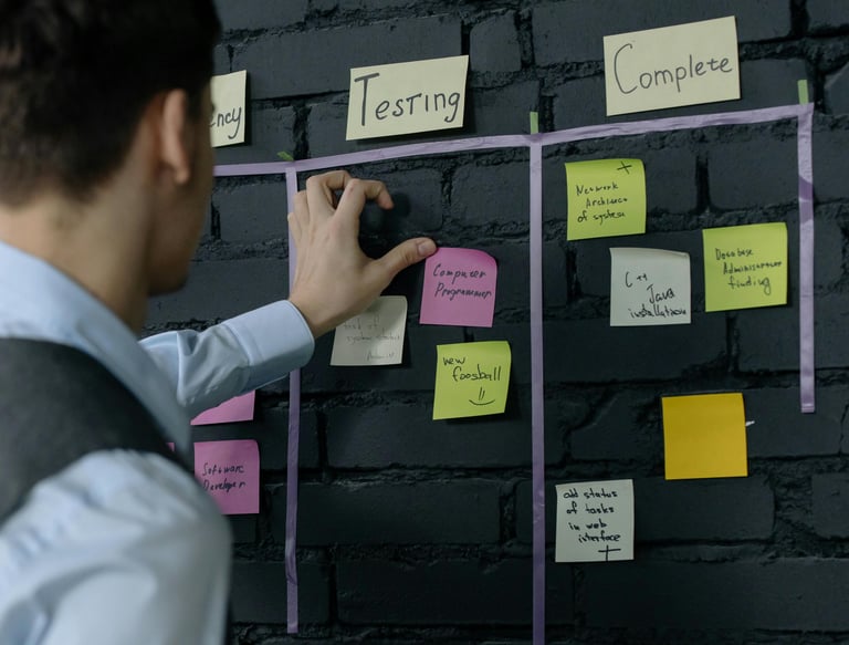 a man in a vest and vest is writing on a wall