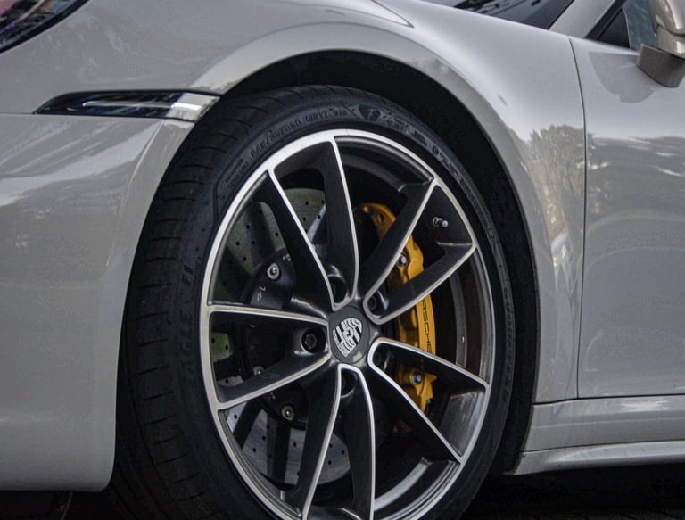 an Enlab porsche 911 gts parked on a sidewalk