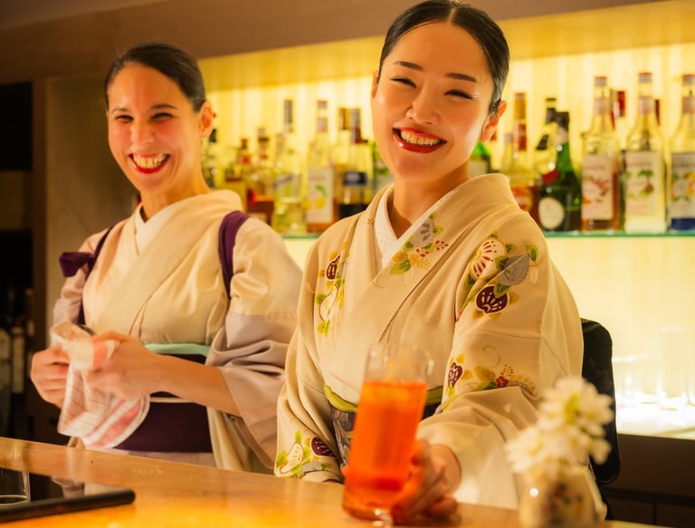 Women dressed in Kimono serving beautiful cocktails