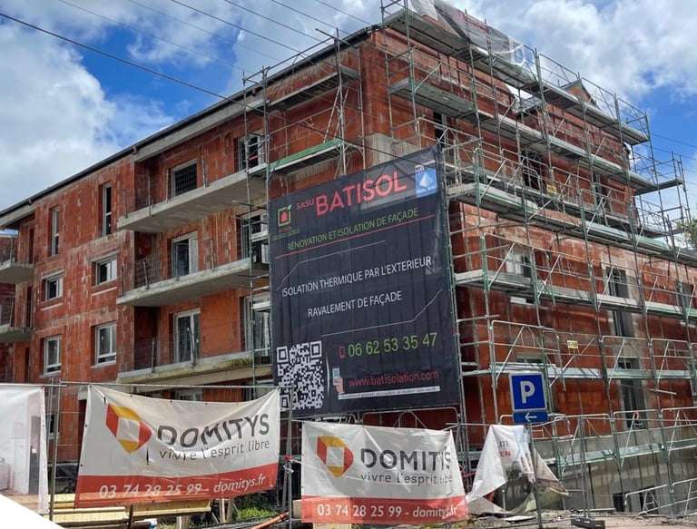 a building with scaffiered signs on it