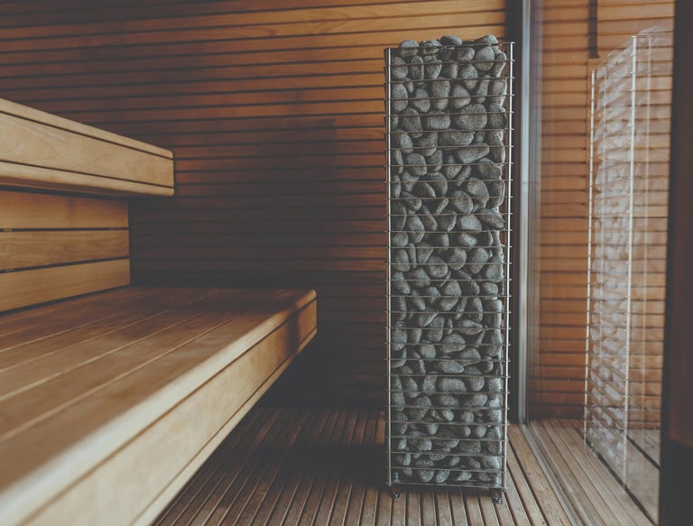 Cedar sauna interior with Scandinavian heater and benches in an Outdoor sauna Ontario design