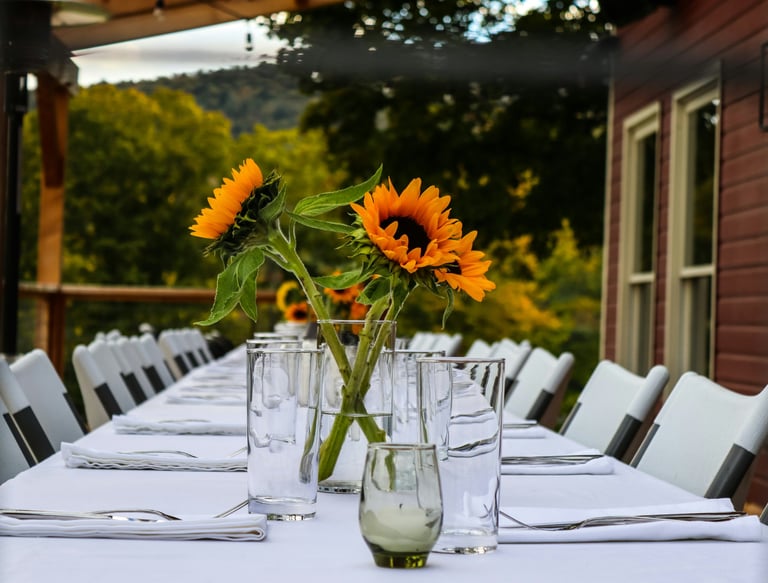 table set for guests, with daisy flowers