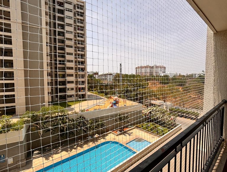 A peaceful balcony free from pigeons with sunlight filtering through the newly installed safety net.