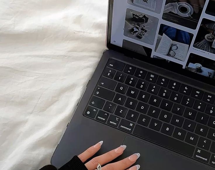 hand on laptop