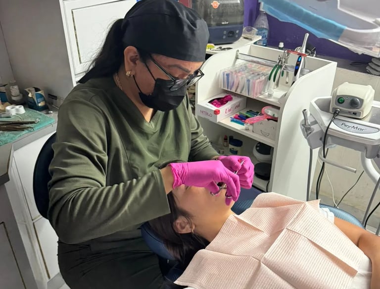 a woman is getting her teeth brushed up and ready to be a dentist