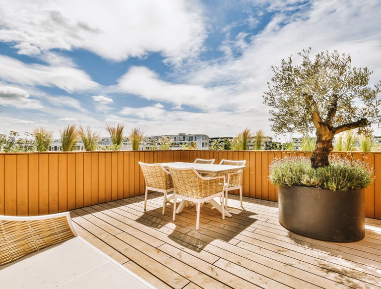 outdoor wooden deck and seating area at an Auckland property