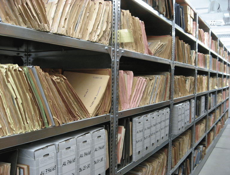 a large collection of files and folders in a large room