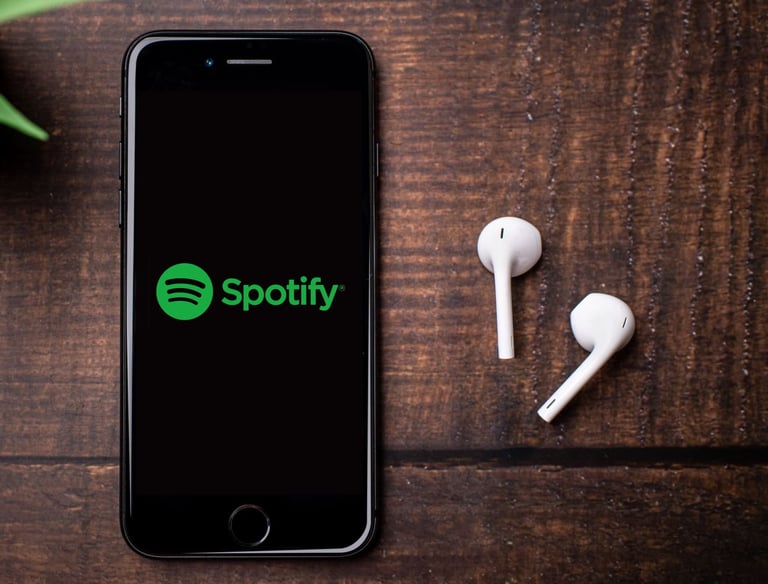 a phone next to pair of earphones