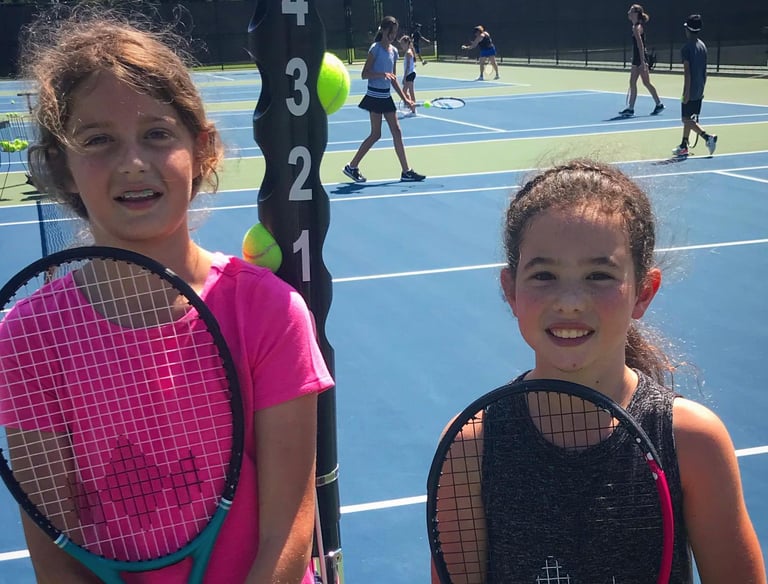 Junior tennis players enjoying league play in Panama City Beach, FL.