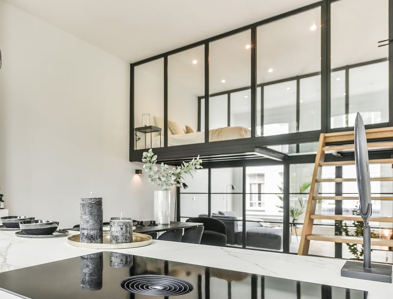 a kitchen with a large counter top and a potted plant