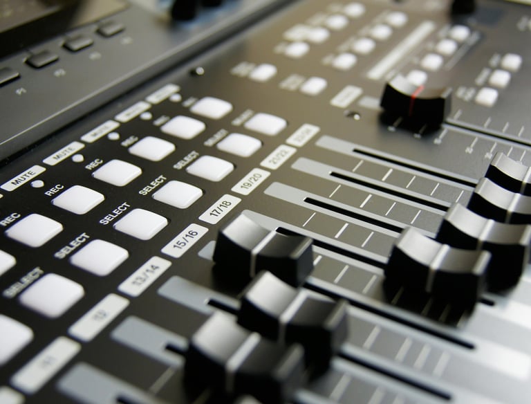 a close up of a sound mixer with a sound board