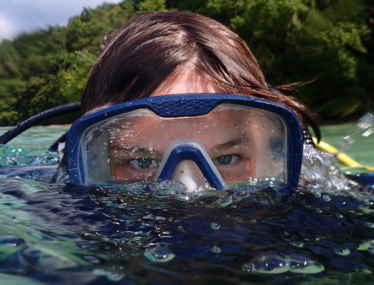a woman in a diving mask and snorh snorg snorg