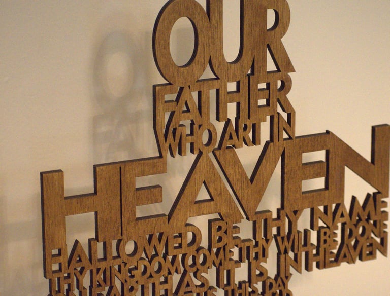 wooden cross shaped Lord's prayer carving