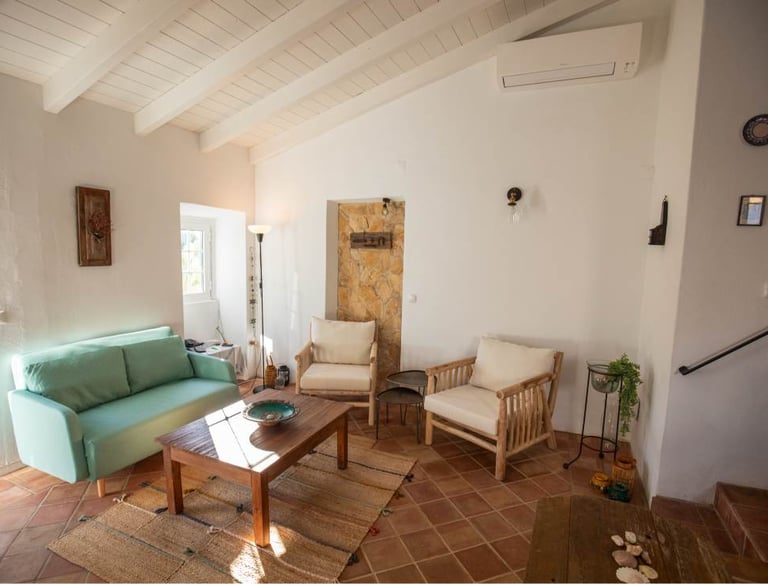 a living room with a couch and a table