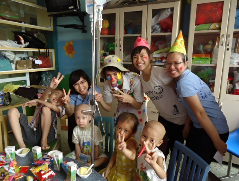 a group of people standing around a table with cake