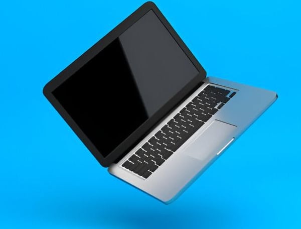 a laptop computer with a laptop on a blue background