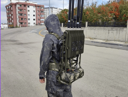 a man in camouflage gear with a backpack on his back