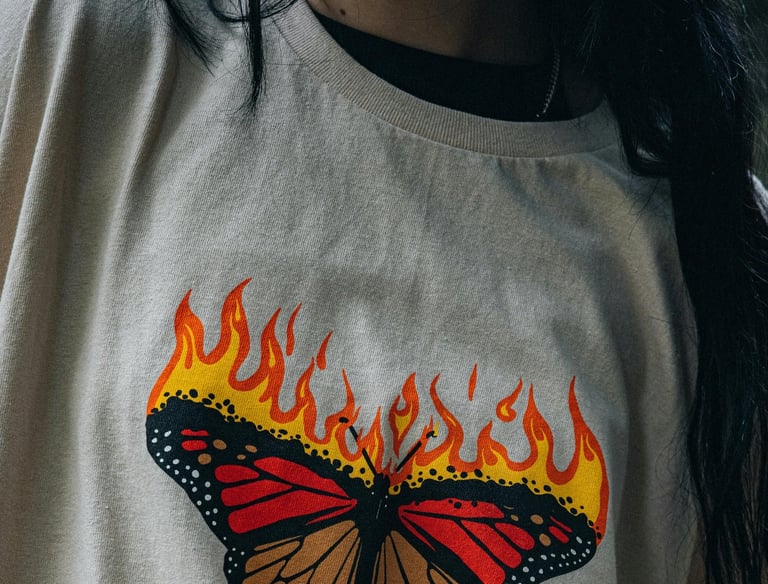 a woman with a butterfly butterfly on a white shirt