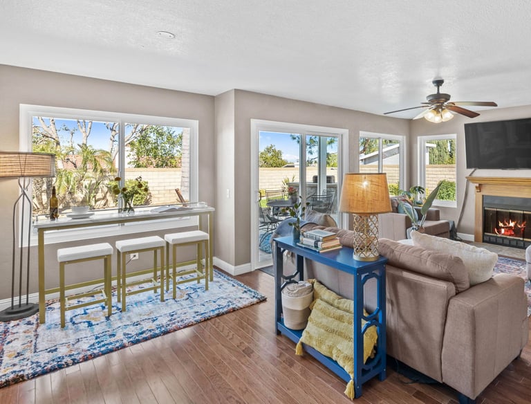 a living room with a couch and a view of a bredroom 